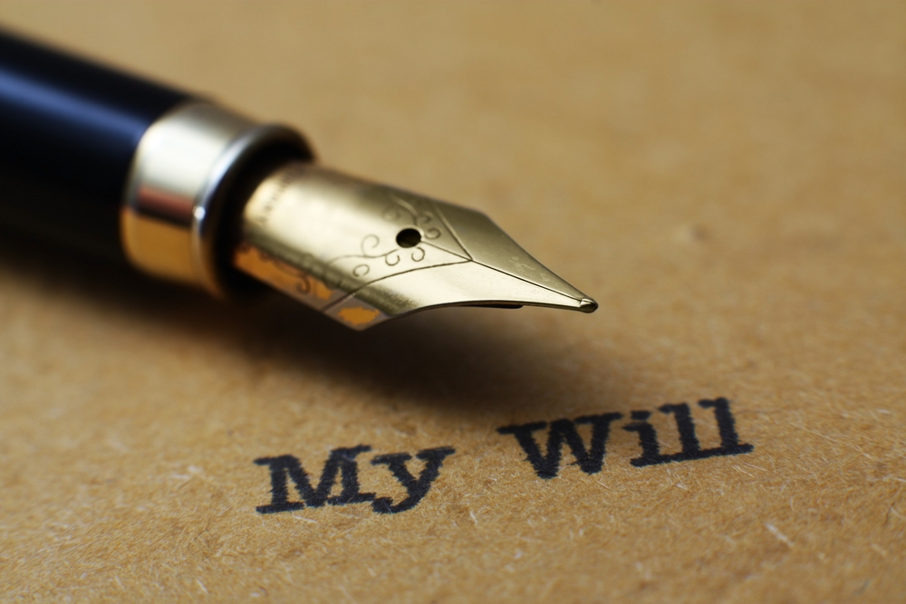 Fancy pen on a document with calligraphy "my Will"